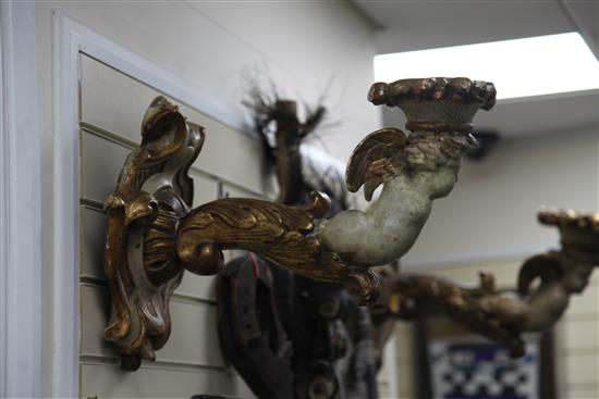 A pair of 19th century Italian carved and painted parcel gilt wall scones, 20in.